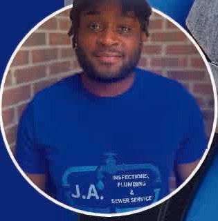 Jamyre Anderson, owner of JA Inspections Plumbing and Sewer, in a blue company shirt