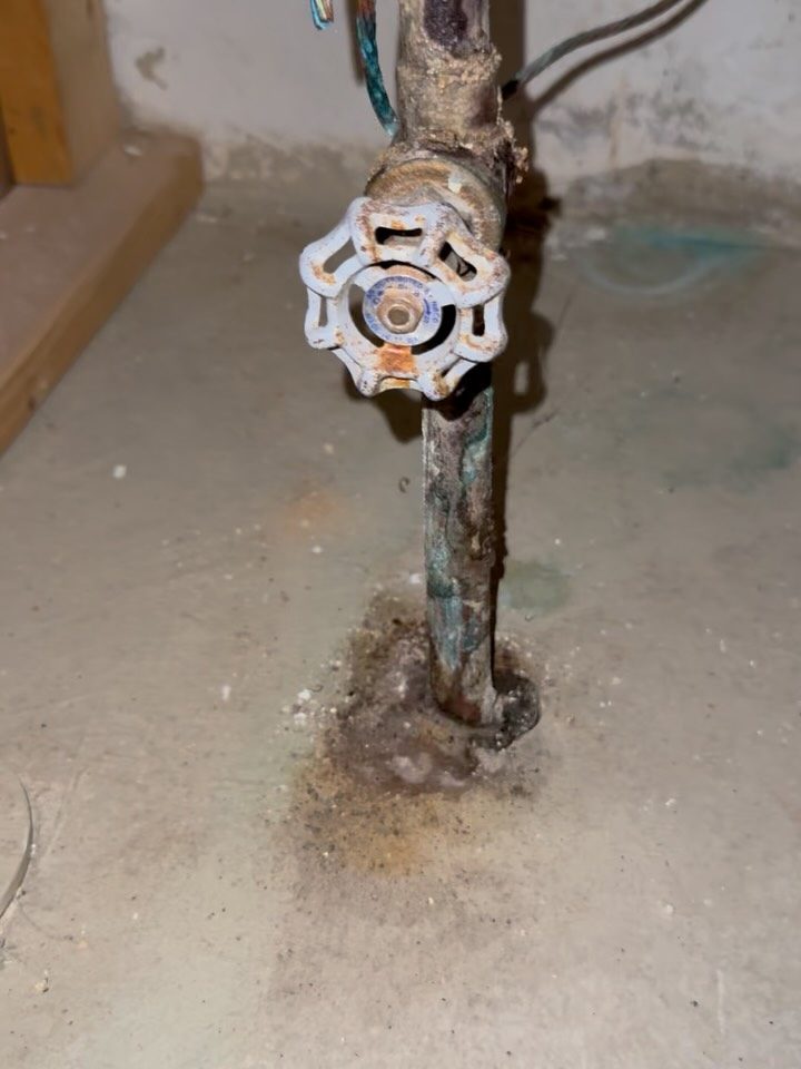 Before: a corroded gate valve on the water service pipe