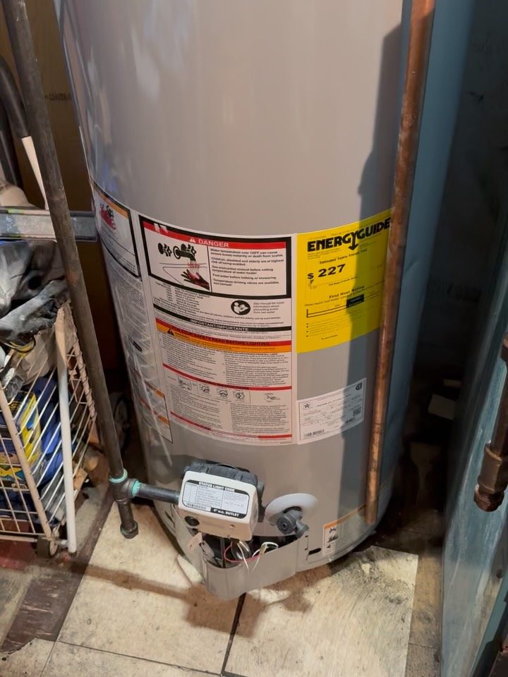 After: new 40-gallon gas water heater with new venting and copper