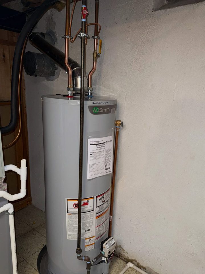 After: new 50-gallon A.O. Smith gas water heater with drain pan and ball valves